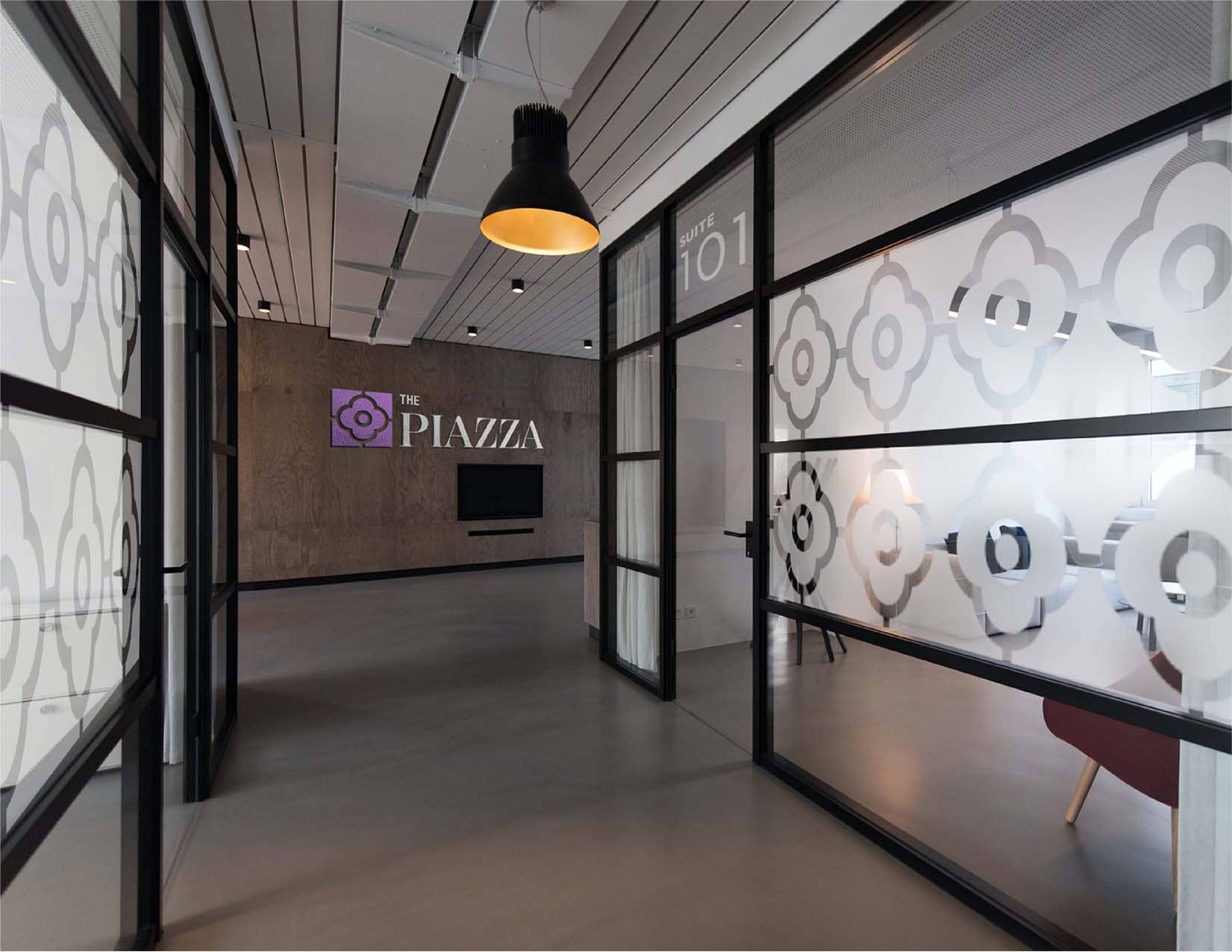 wall with the piazza logo inside an office building