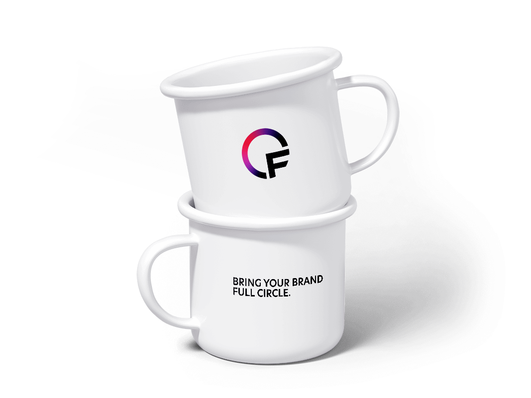 Full Circle logo and slogan on white mugs