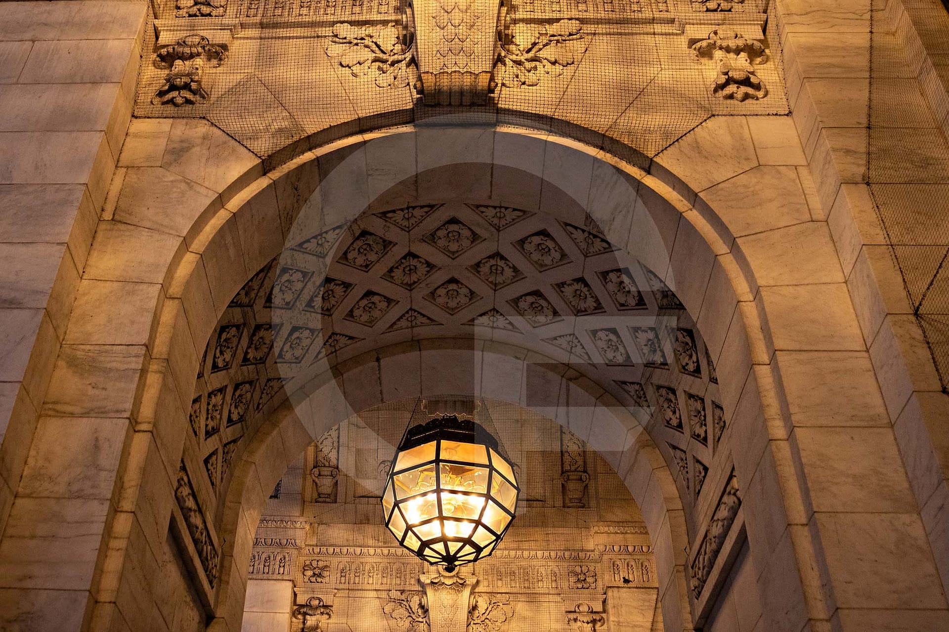 light fixture in a stone arch