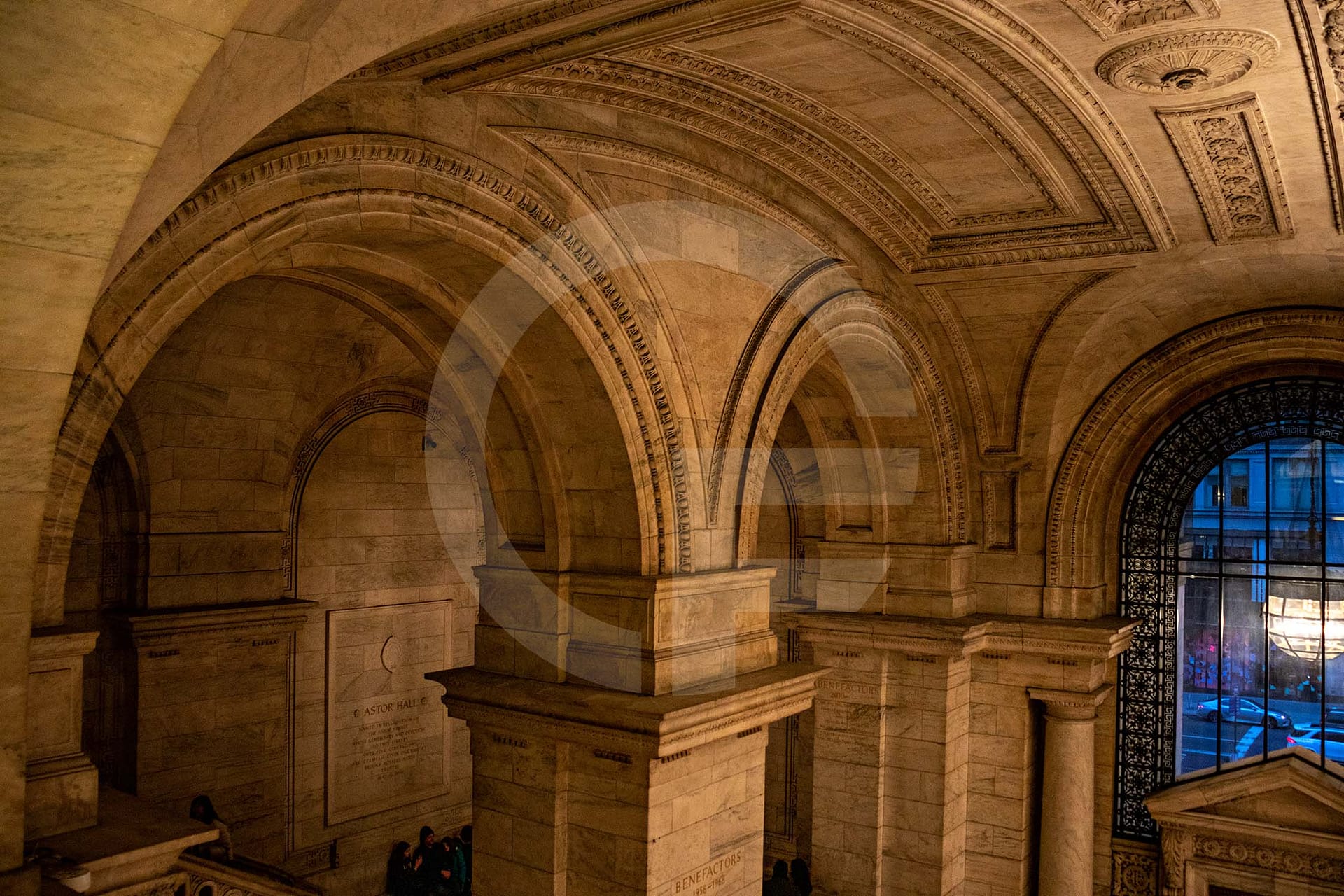 library lobby with stone arches